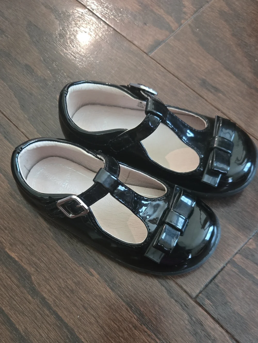 Girls Black Patent T-Strap Dress Shoes with Bow Accent